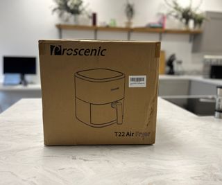 Prosenic T22 in a cardboard box on a kitchen counter.