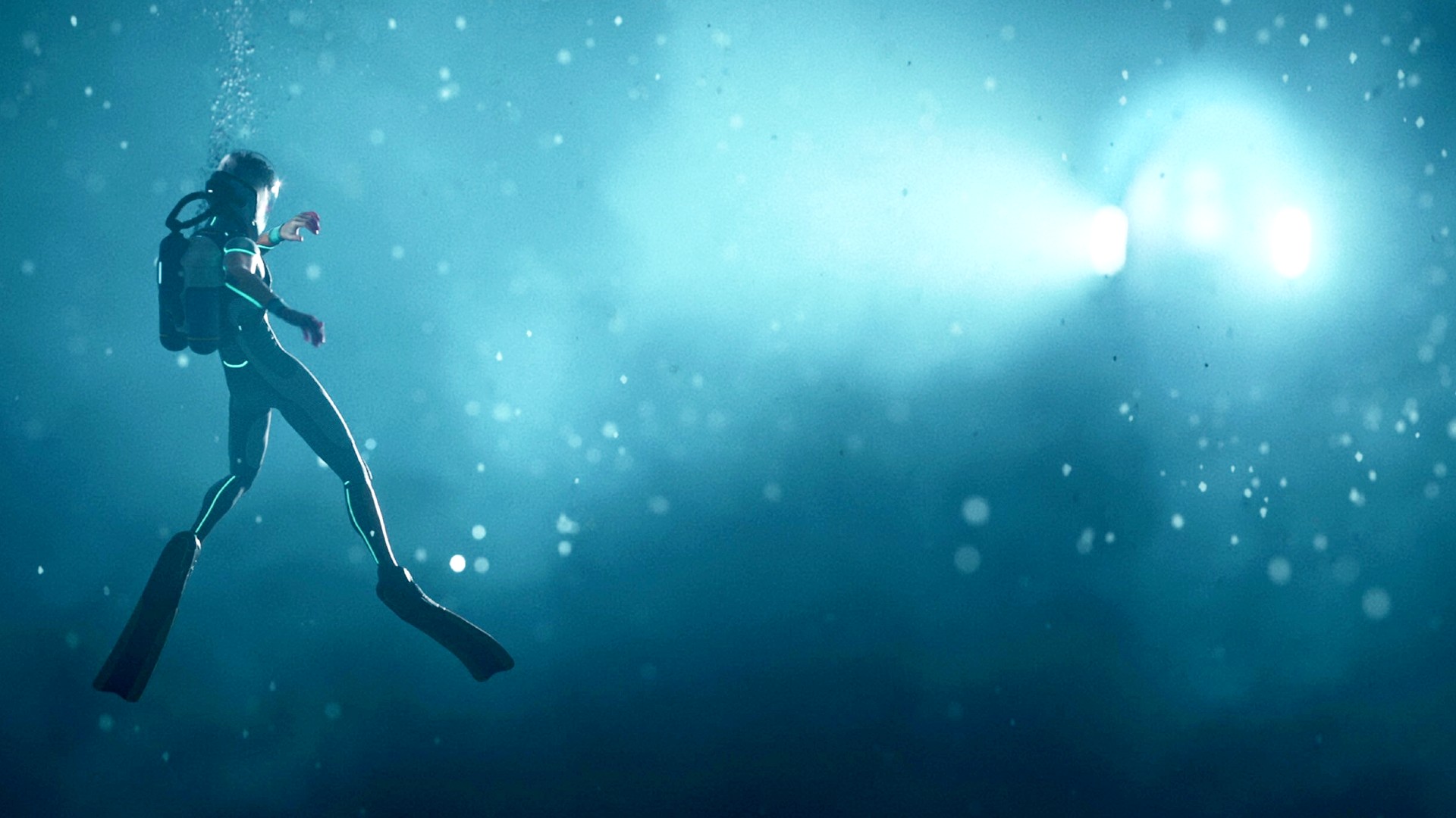 A diver is lit up by an underwater vehicles headlights in Subnautica 2.
