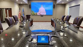 A dvLED Daktronics display brightens up an empty boardroom.