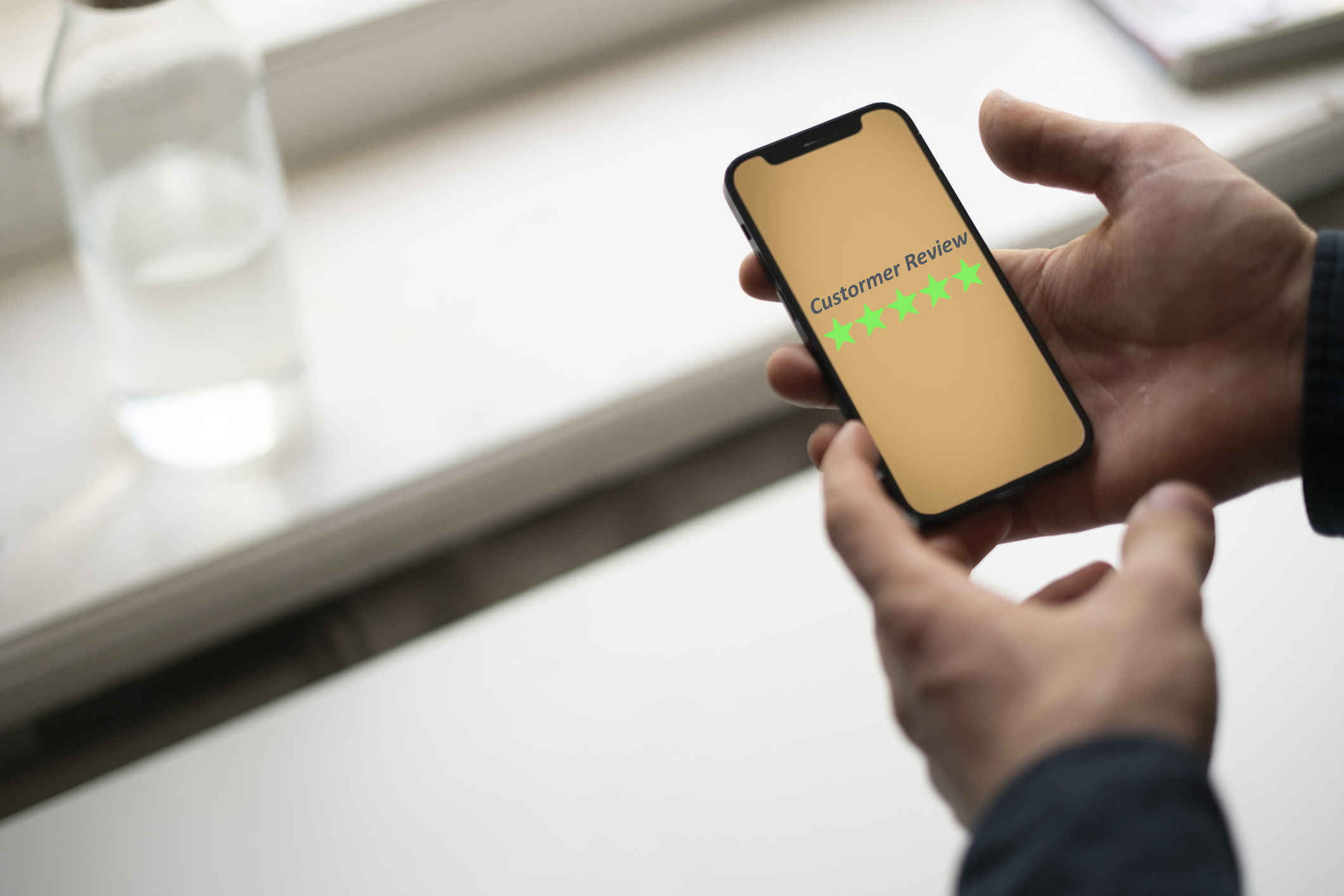 Smartphone screen with five star quality review
