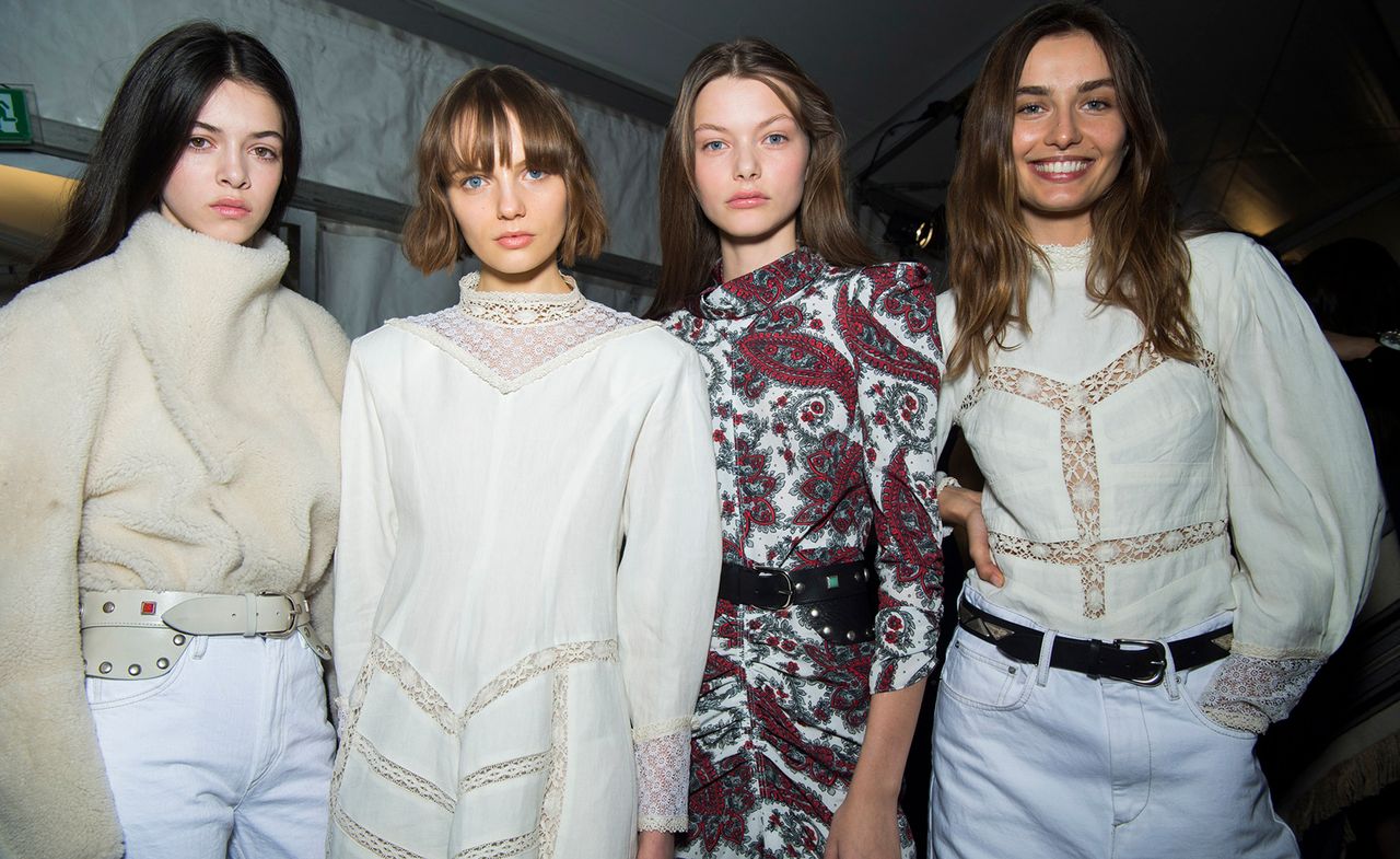 Isabel Marant&#039;s A/W 2018 show with models wearing cream shearling jumpers, white lace dresses and a paisley jumpsuit