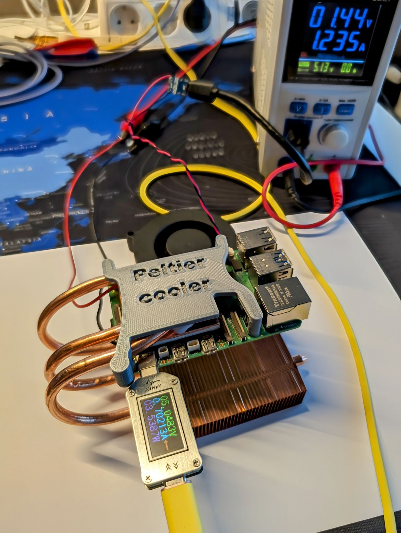 Raspberry Pi 5 delidded and cooled using a Peltier element