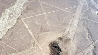 Mysterious Nazca lines on desert in Peru, South America. There doesn't appear to be any kind of picture, just lots of straight lines here and there.