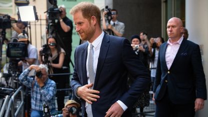 Prince Harry headed into High Court in the U.K. with photographers surrounding him