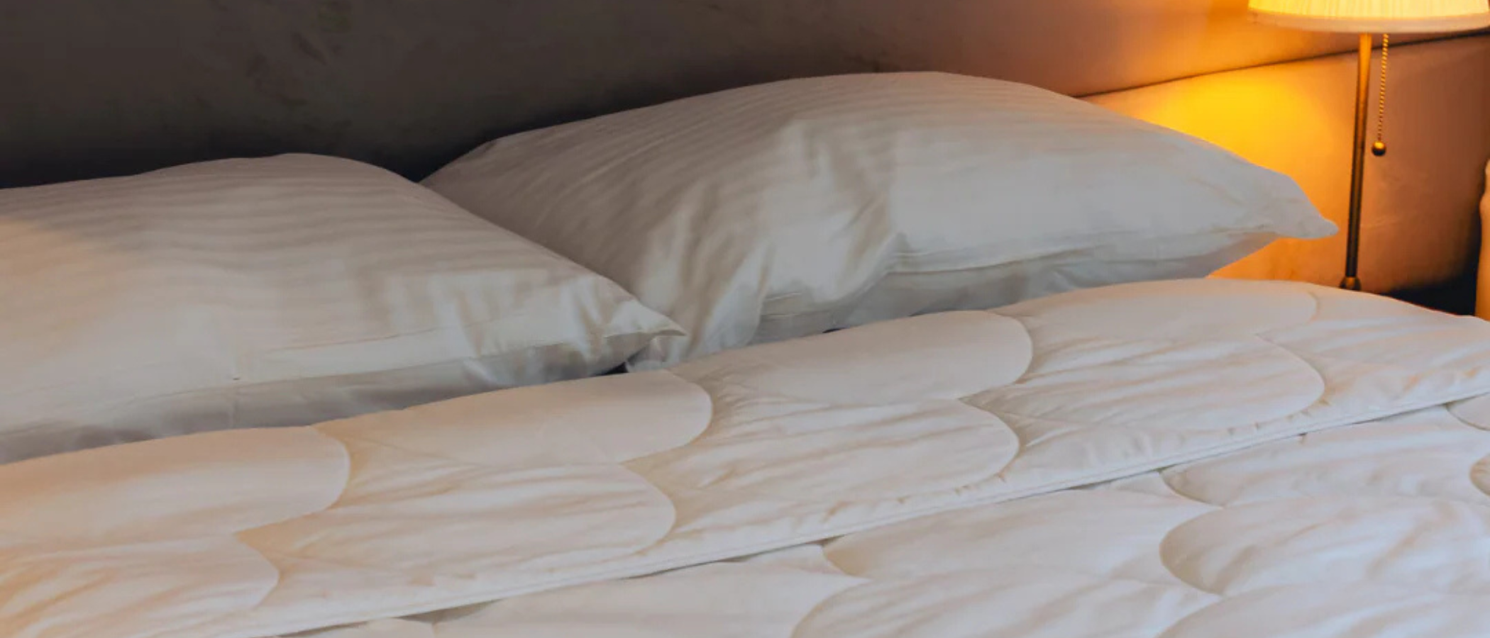 Larke Nature's Blend duvet draped over the bed 