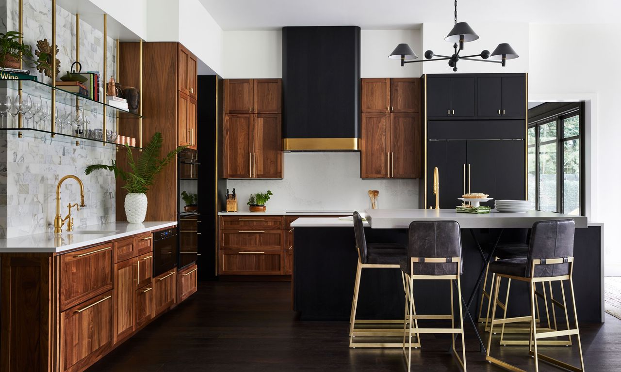 Dark mahogancy cabinetry in modern kitchen with large island and tall bar stools