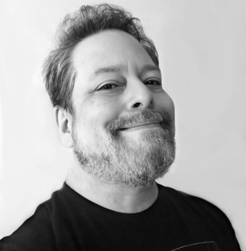 a bearded man in a black-and-white photo