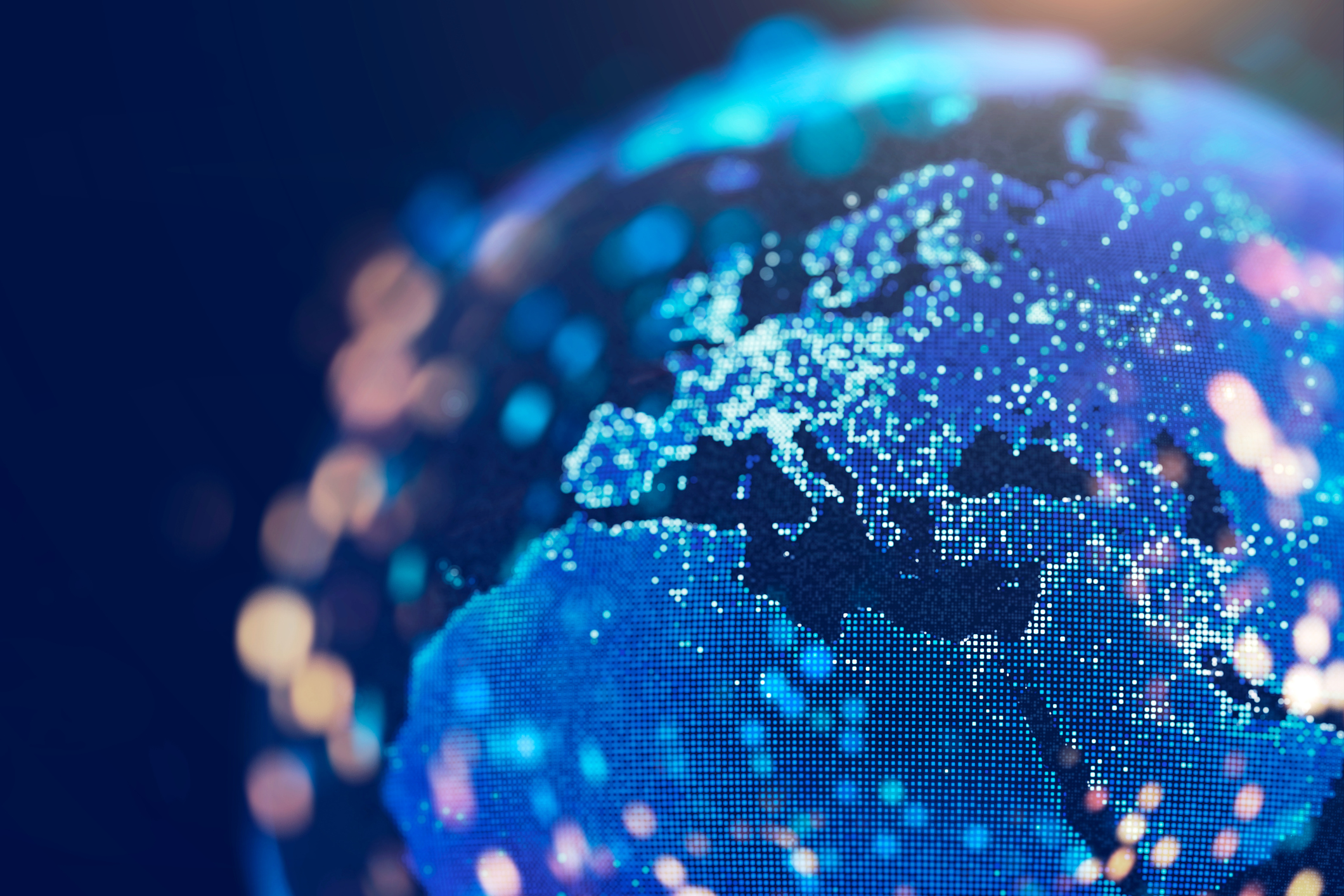 A dotted earth with lights bokeh on a dark blue background.