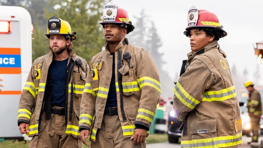Pictured (L-R): Max Thieriot as Bode Leone, Jordan Calloway as Jake Crawford, and Jules Latimer as Eve Edwards. They&#039;re all standing in fire gear. 