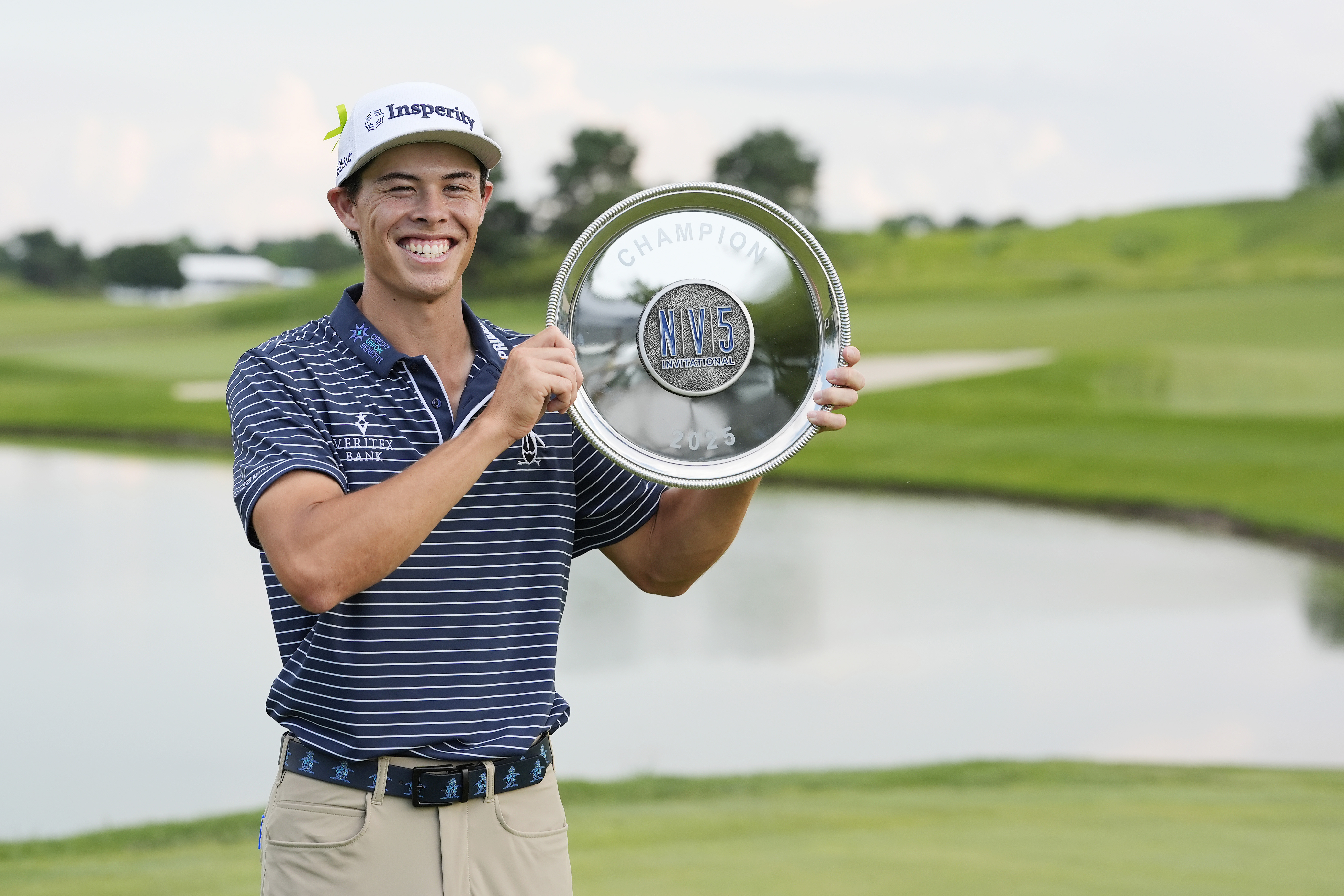 Johnny Keefer holds a trophy
