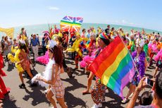 Brighton Pride parade goers along the seafront