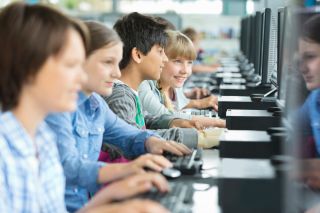 Students using computers in classroom