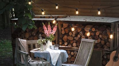 string light ideas - festoons from lights for fun with bistro set