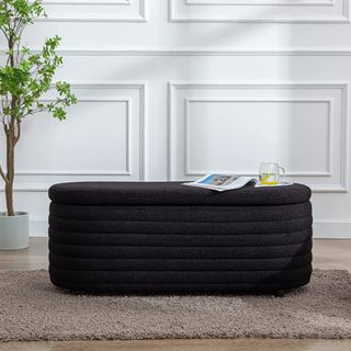 Kmax Storage Bench Faux Fur in black with magazine and mug on top
