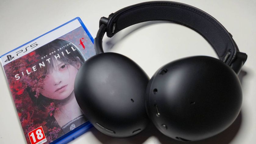 Photo of a black Sony headset sitting on a PS5 game box.