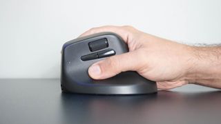 A person using the Keychron M5 vertical mouse on a desk
