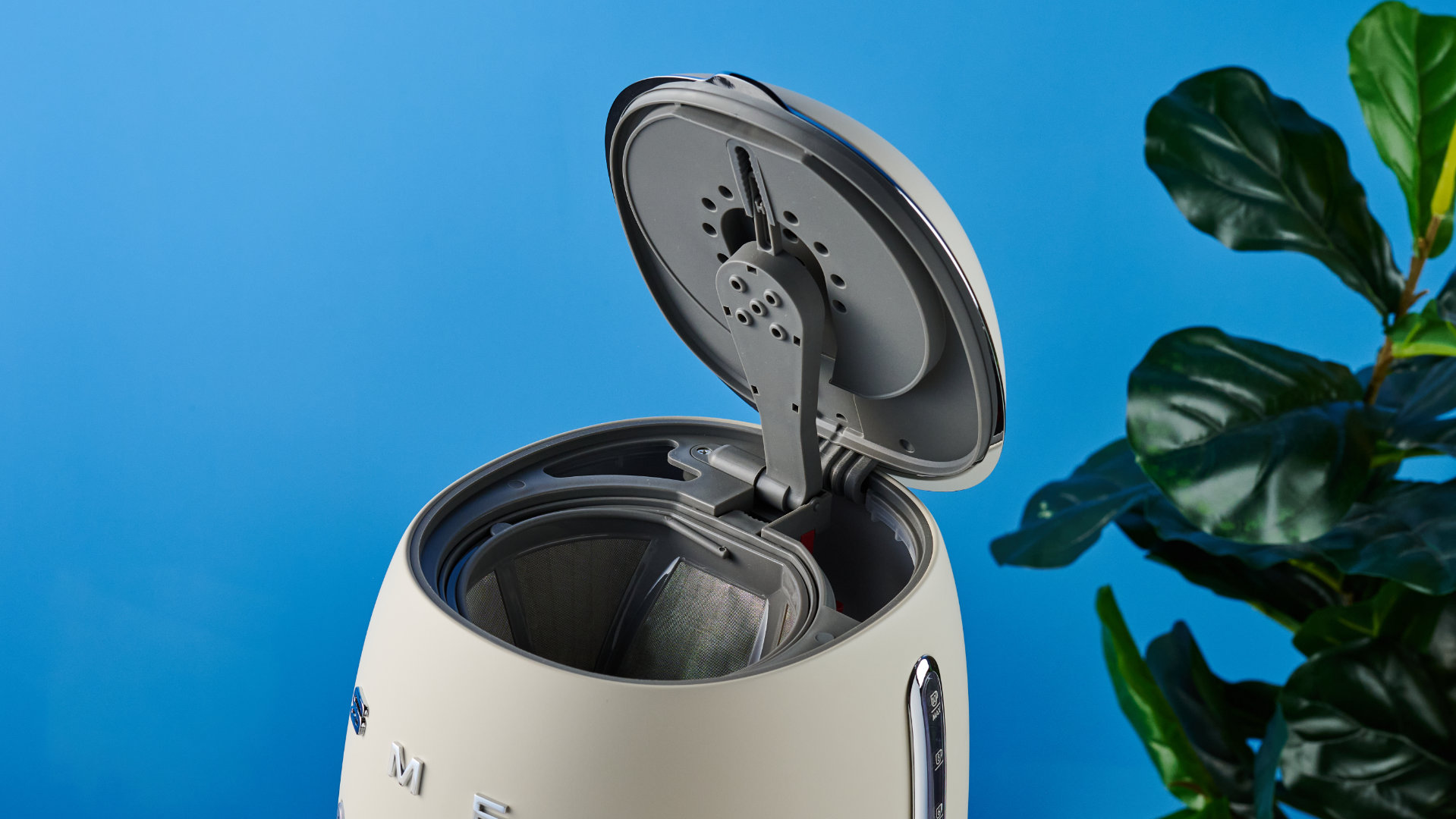 the smeg retro coffee maker photographed against the blue tom's guide background