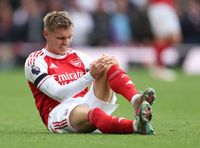 LONDON, ENGLAND - OCTOBER 4: Arsenal's Martin Odegaard sustains an injury during the Premier League match between Arsenal and West Ham United at Emirates Stadium on October 4, 2025 in London, England. (Photo by Rob Newell - CameraSport via Getty Images)