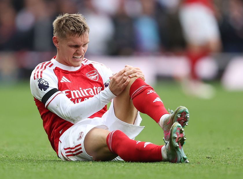 LONDON, ENGLAND - OCTOBER 4: Arsenal&amp;apos;s Martin Odegaard sustains an injury during the Premier League match between Arsenal and West Ham United at Emirates Stadium on October 4, 2025 in London, England. (Photo by Rob Newell - CameraSport via Getty Images)