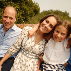 Kate Middleton, Prince William and Princess Charlotte hugging outside