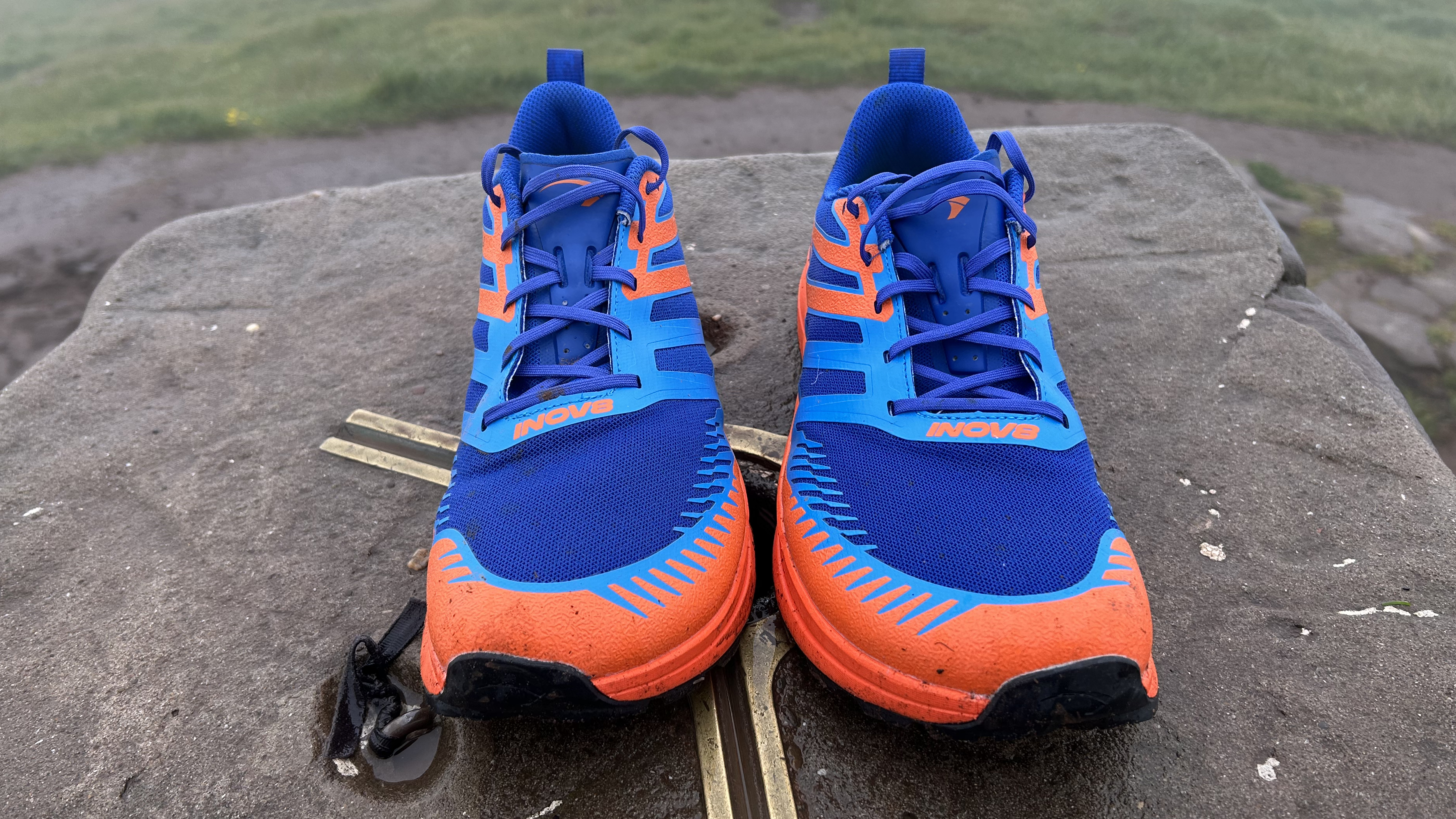 Inov8 Trailfly Zeros on a trig point