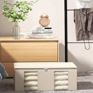 A beige sheet storage box in a bedroom