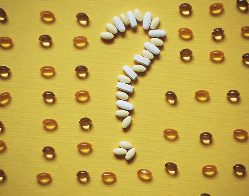 Dietary supplements arranged to form a question mark.