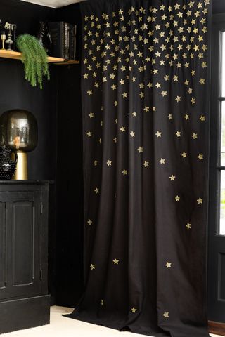Black curtain with gold embroidered stars Rockett St George