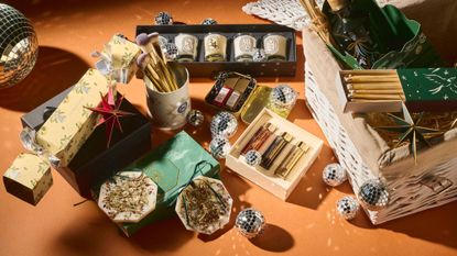 A collection of the best Christmas Beauty Gift sets shot amongst festive disco ball baubles