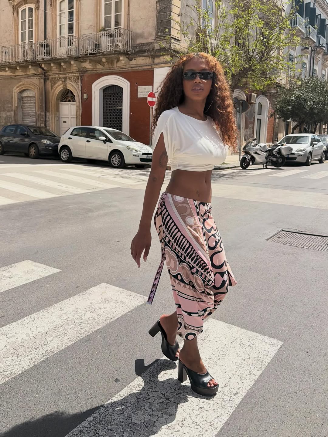 An image of a woman wearing timeless summer outfit