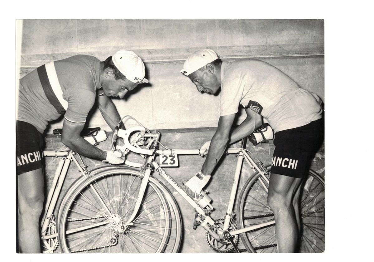 Teammate Giancarlo Astrua and Conterno check their bikes during the 1956 Vuelta