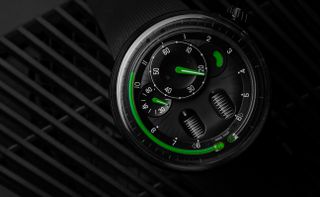 H0 Black with titanium case, unstructured, fluid hour display dial and rubber strap with titanium deployant buckle