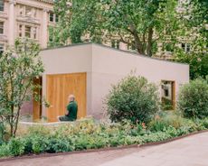 view of Finsbury Circus Parks Office, a minimalist, earthy building set among leafy garden