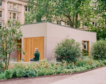 view of Finsbury Circus Parks Office, a minimalist, earthy building set among leafy garden