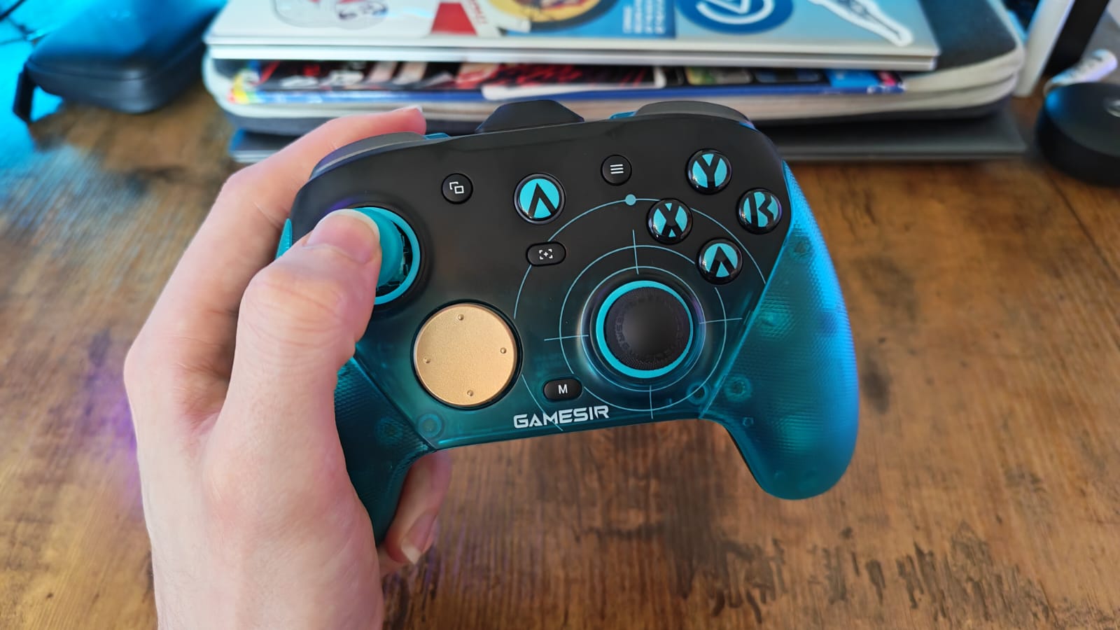 A reviewer holding the GameSir G7 Pro 8K PC controller