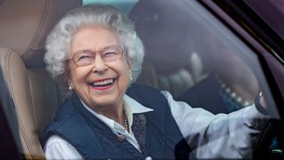 Queen Elizabeth II seen driving her Range Rover car