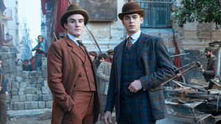 Moriarty and Sherlock stand in a street during the French Revolution