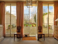 Fig 2: The raised terrace to the rear is infilled with rubble. Narrow wings frame the view. The Great House, Dedham. ©Paul Highnam for Country Life.