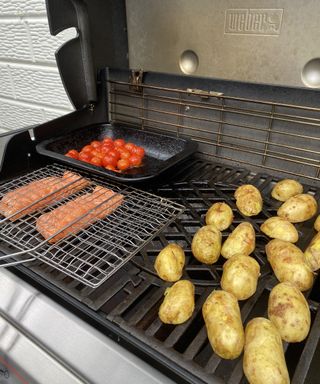 cooking salmon, potatoes and tomatoes on a Weber gas BBQ