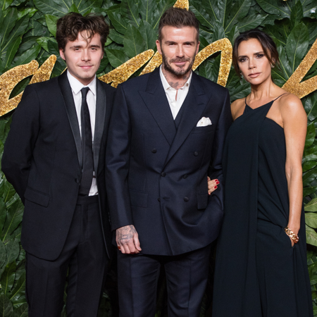 Brooklyn Beckham, David Beckham and Victoria Beckham arrive at The Fashion Awards 2018 In Partnership With Swarovski at Royal Albert Hall on December 10, 2018 in London, England
