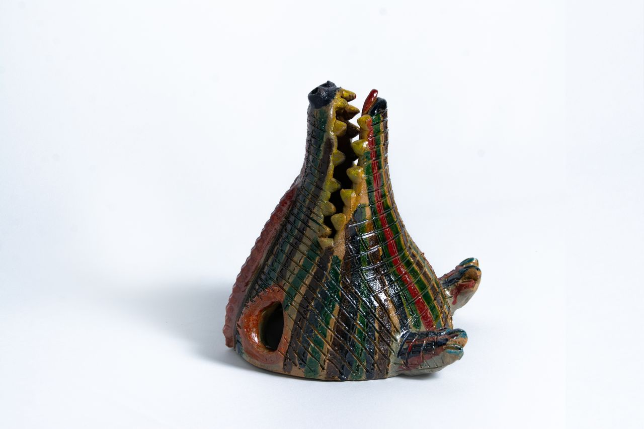Colourful animal head ceramic vessels