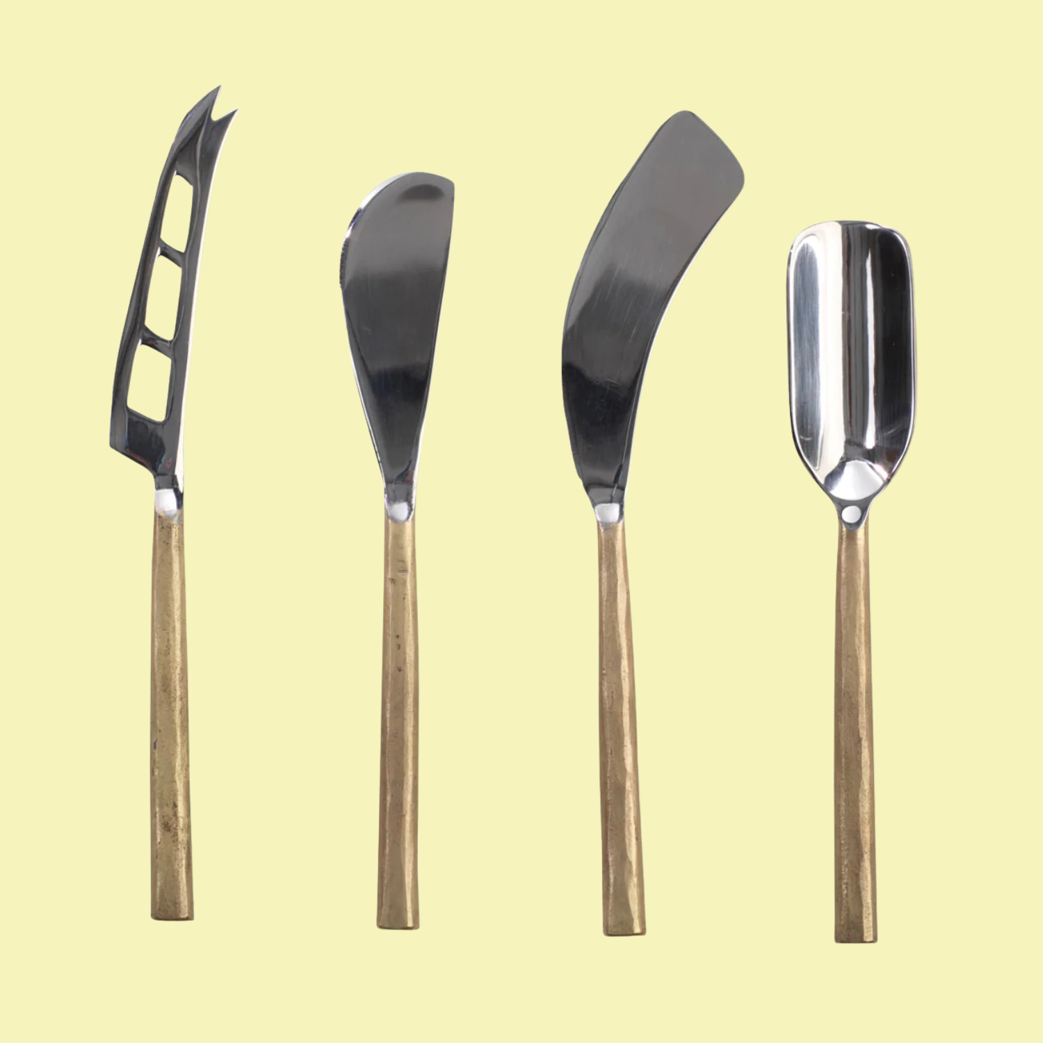 A brushed gold set of cheese knives