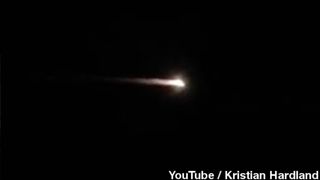 An image from a YouTube video shows flaming rocket debris over Australia, on July 10, 2014.