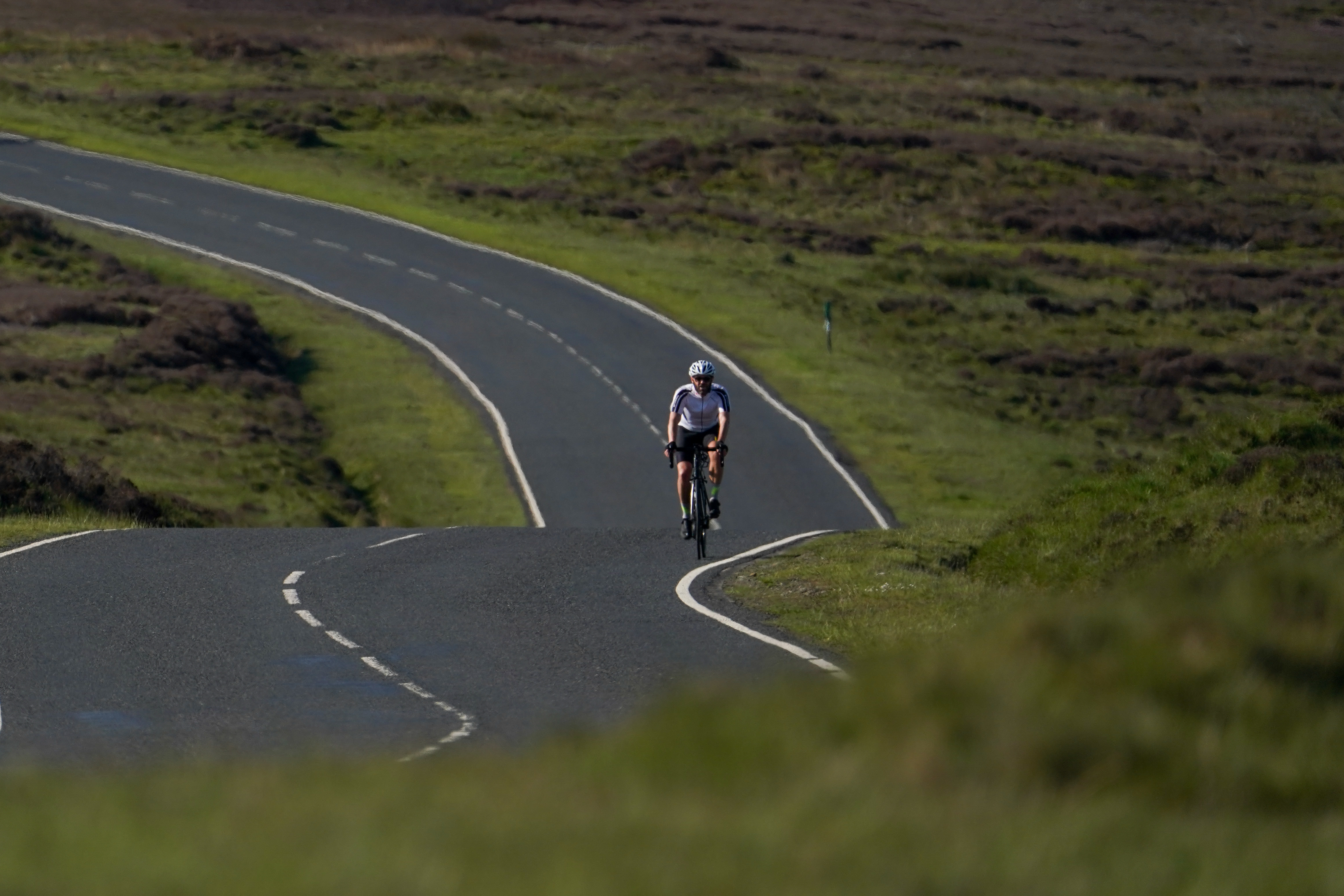 A rider rides on 25 May in extreme heat