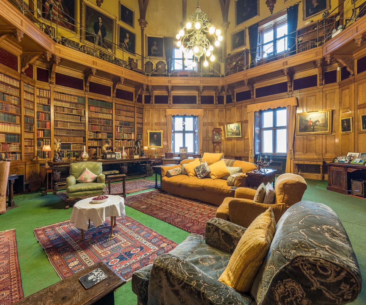 A large oval library with integral bookshelves