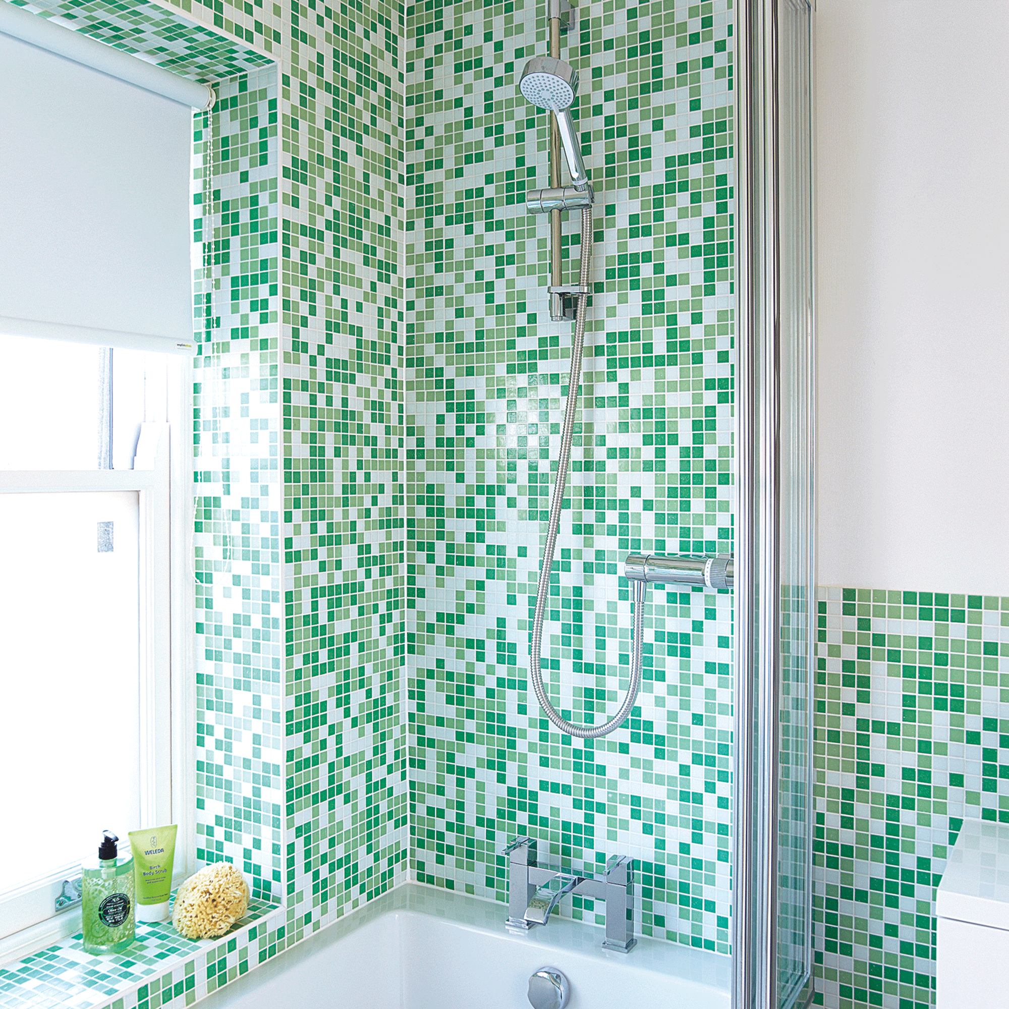 Green mosaic tiles in shower
