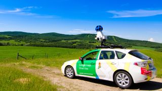 Google street view car watching over a field