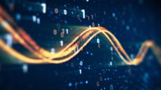 Network traffic concept image showing orange-colored flowing data line imposed over a digital interface with binary code.