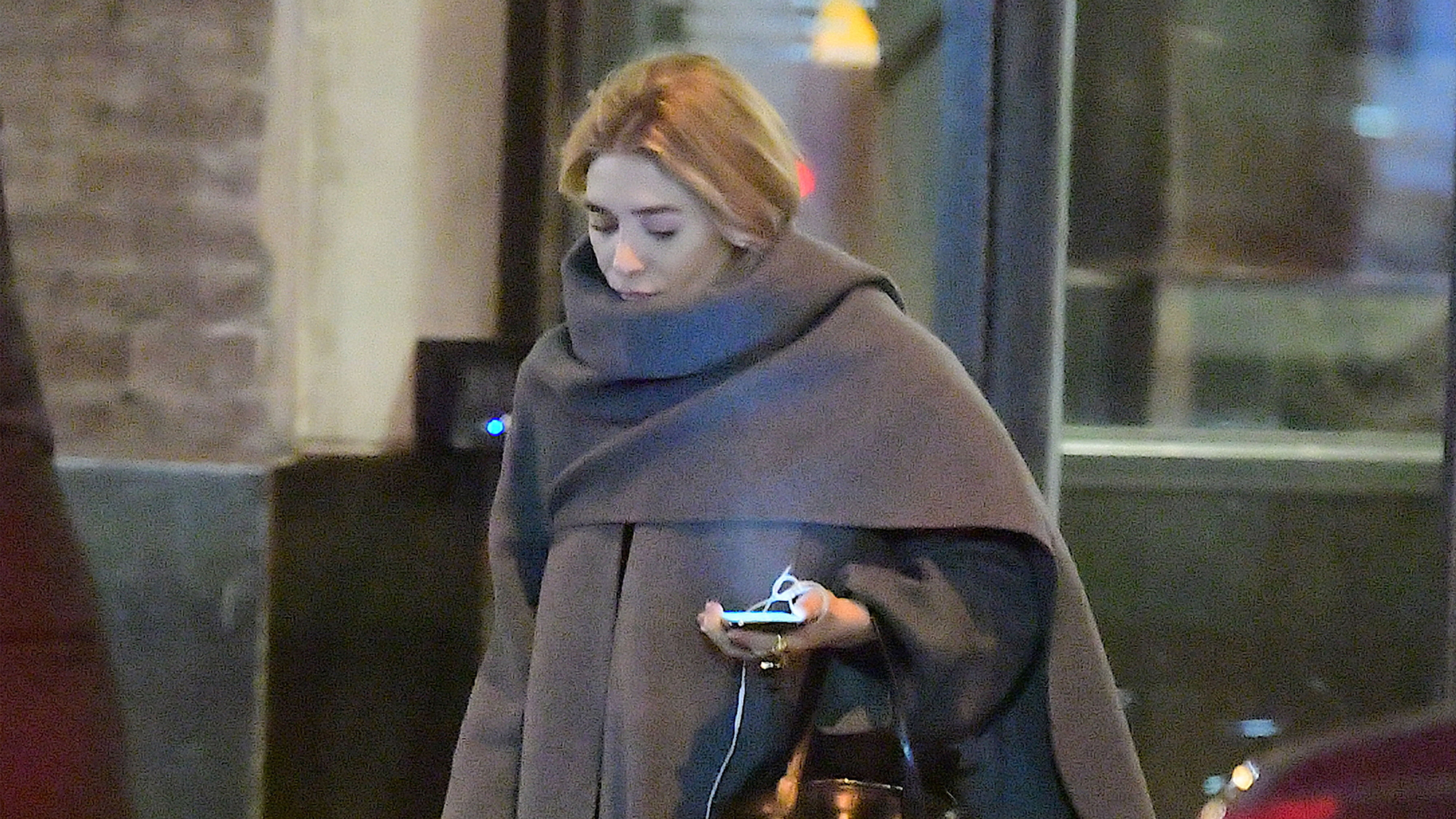 Ashley Olsen wearing a cape coat