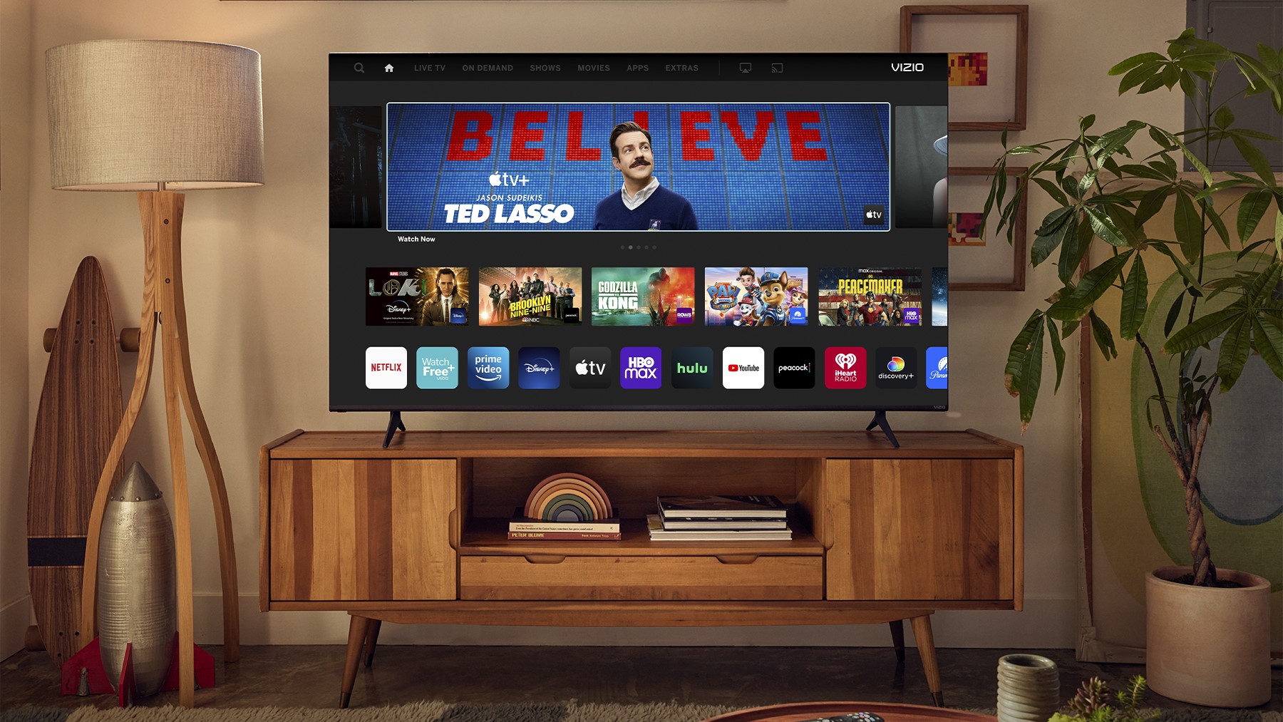 The Vizio V-Series 2023 on an entertainment stand in a living room.